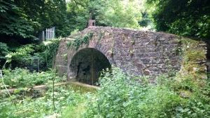 Follow the towpath over the canal by this bridge
